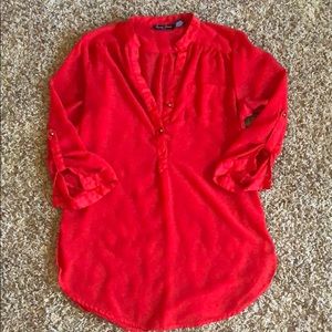 Red tunic length blouse